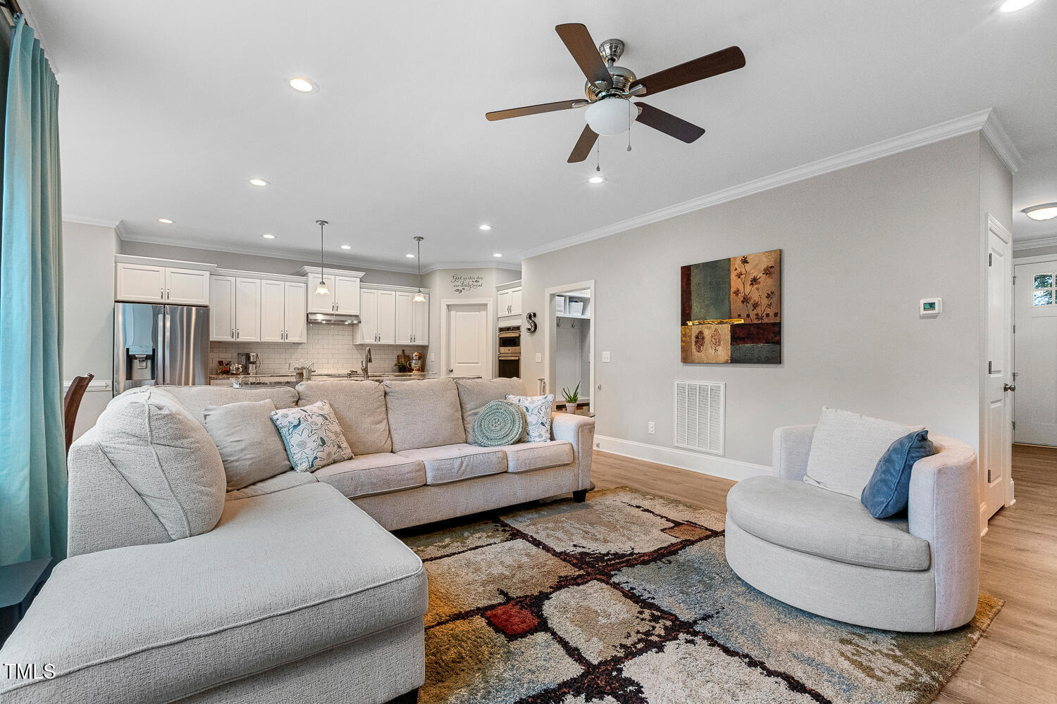 830 Wilbon Road Holly Springs, NC 27540 - Photo 7 of 60 a living room with furniture kitchen view and a window