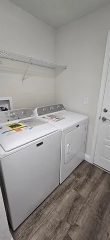 a utility room with dryer and washer