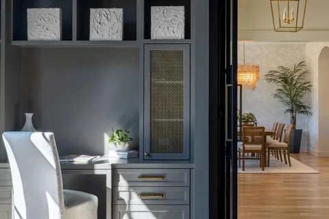 a spacious bedroom with a bed and a flat screen tv