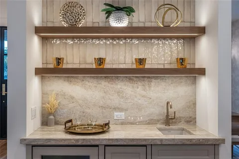 a hallway with wooden floor and entryway