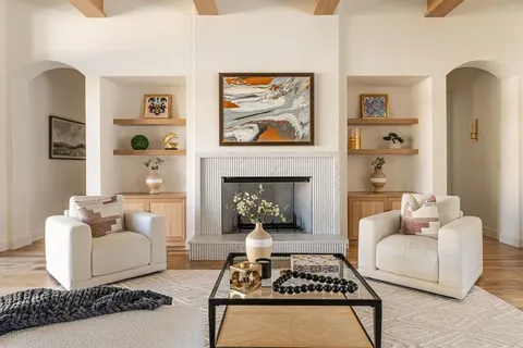 a bathroom with a sink a toilet a mirror and window