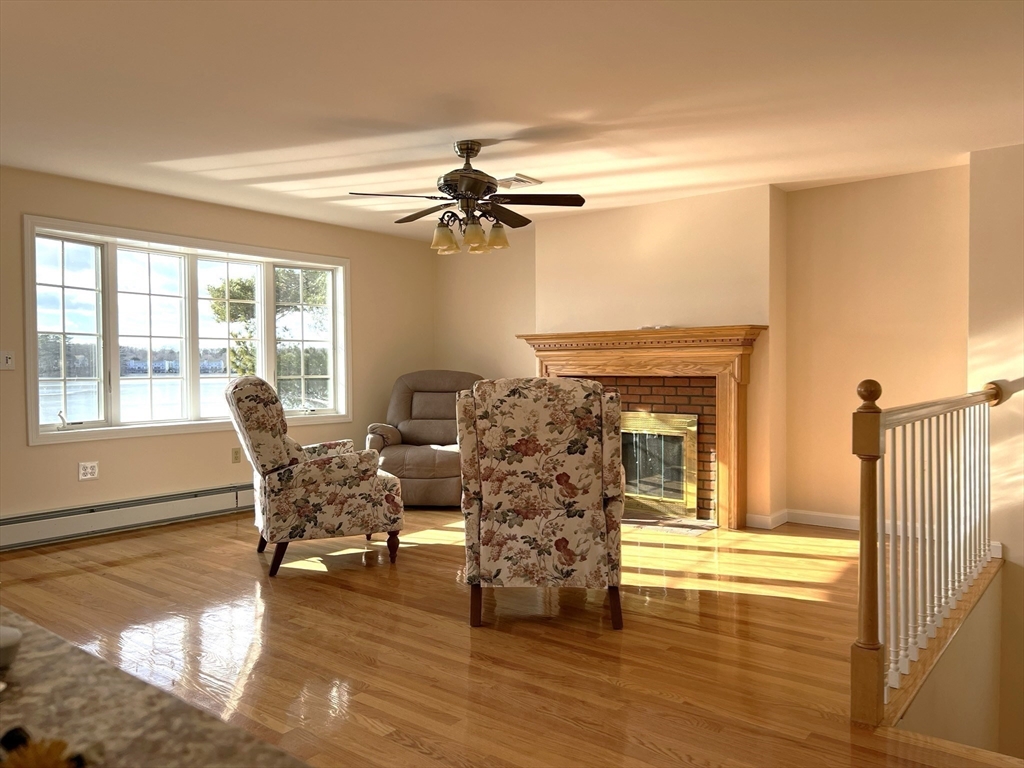 10 Indian Point Road Webster, MA 01570 - Photo 11 of 12 a living room with furniture and a fireplace