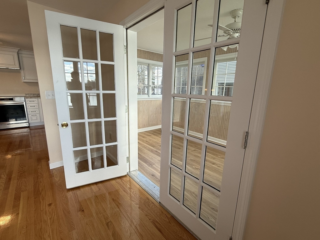 10 Indian Point Road Webster, MA 01570 - Photo 12 of 12 a view of an empty room with wooden floor and windows