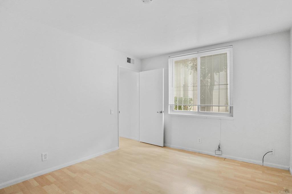 4891 Collwood Boulevard, Unit B San Diego, CA 92115 - Photo 26 of 34 a view of an empty room with a window