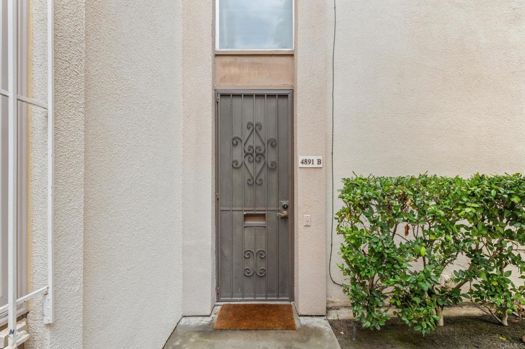 4891 Collwood Boulevard, Unit B San Diego, CA 92115 - Photo 28 of 34 a view of walk in closet with wooden floor