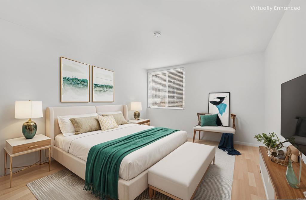 4891 Collwood Boulevard, Unit B San Diego, CA 92115 - Photo 3 of 34 a bedroom with a bed and a flat screen tv