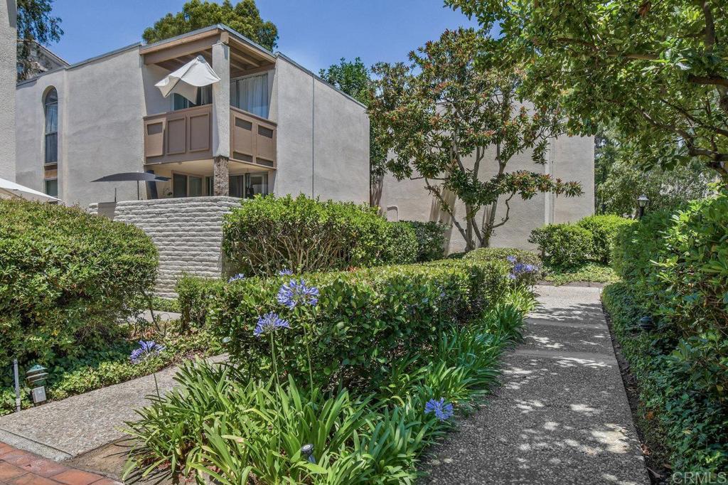 4891 Collwood Boulevard, Unit B San Diego, CA 92115 - Photo 31 of 34 a front view of a house with a yard