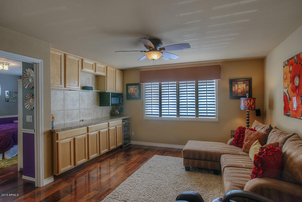 7532 East Alameda Road Scottsdale, AZ 85255 - Photo 12 of 27 a living room with furniture and a window
