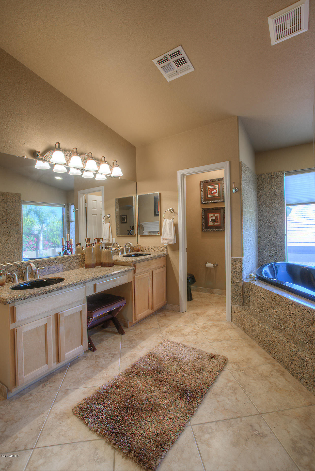 7532 East Alameda Road Scottsdale, AZ 85255 - Photo 15 of 27 a large bathroom with a large tub and sink