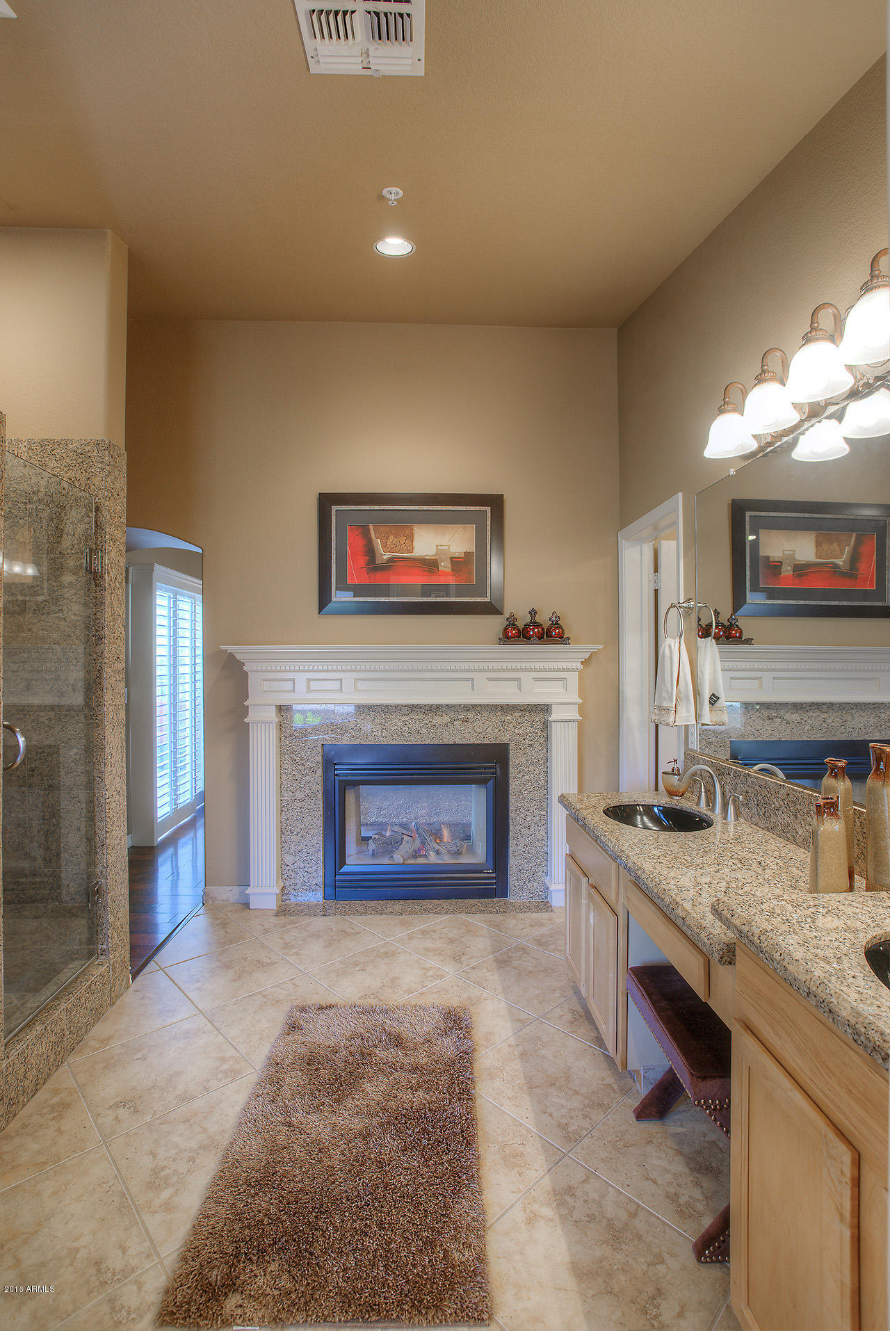 7532 East Alameda Road Scottsdale, AZ 85255 - Photo 16 of 27 a living room with furniture and a fireplace