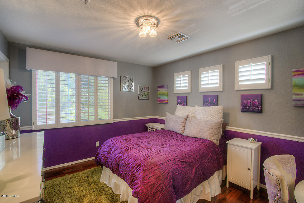 7532 East Alameda Road Scottsdale, AZ 85255 - Photo 20 of 27 a bed room with a bed and a couch