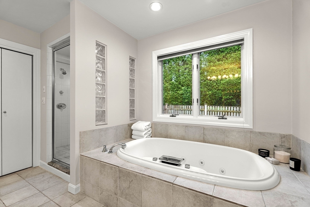 53 Gerald Road Marblehead, MA 01945 - Photo 18 of 42 a bath tub sitting in a bathroom next to a window