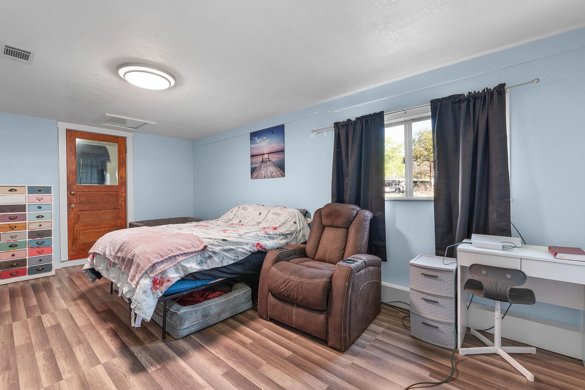 1365 Norma Tow, TX 78672 - Photo 22 of 45 a bedroom with a bed and wooden floor