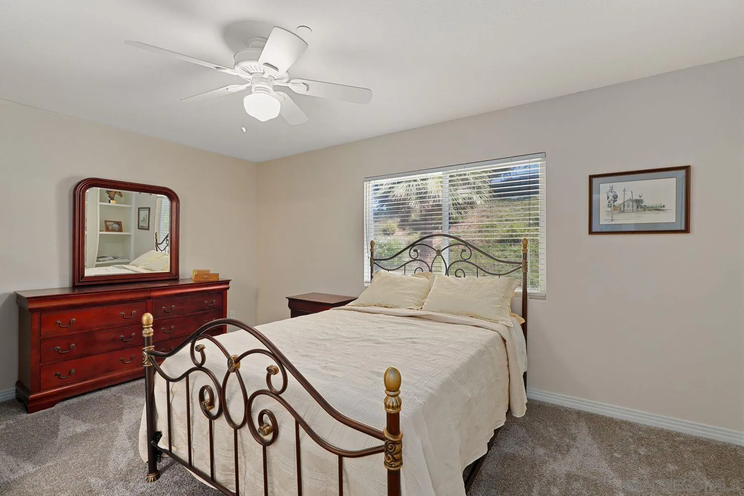 554 Poets Square Fallbrook, CA 92028 - Photo 17 of 28 a bedroom with a bed and a chandelier