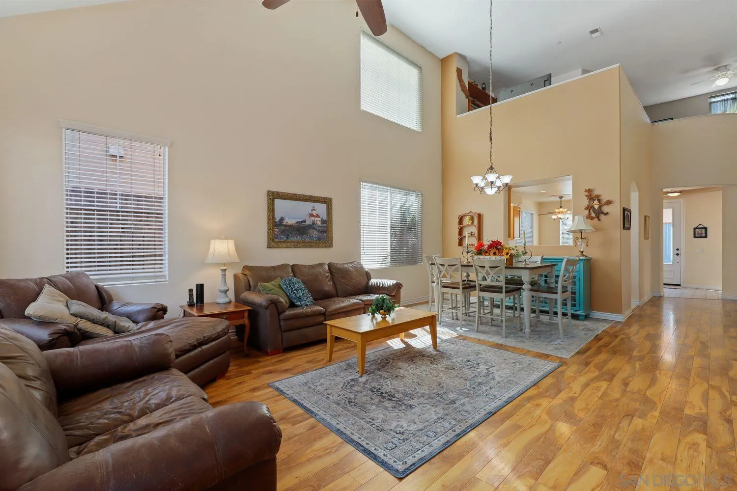 554 Poets Square Fallbrook, CA 92028 - Photo 2 of 28 a living room with furniture and wooden floor