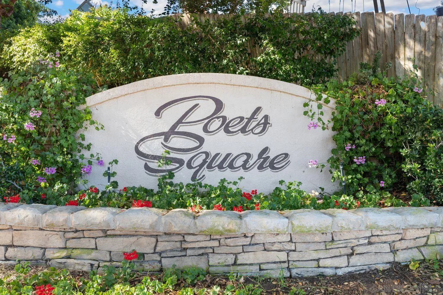 554 Poets Square Fallbrook, CA 92028 - Photo 28 of 28 a view of a sign board with flower