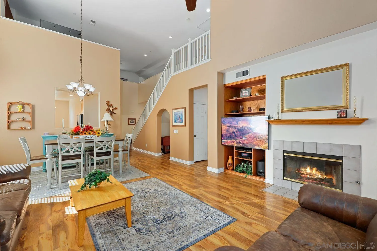 554 Poets Square Fallbrook, CA 92028 - Photo 3 of 28 a living room with furniture fireplace and rug