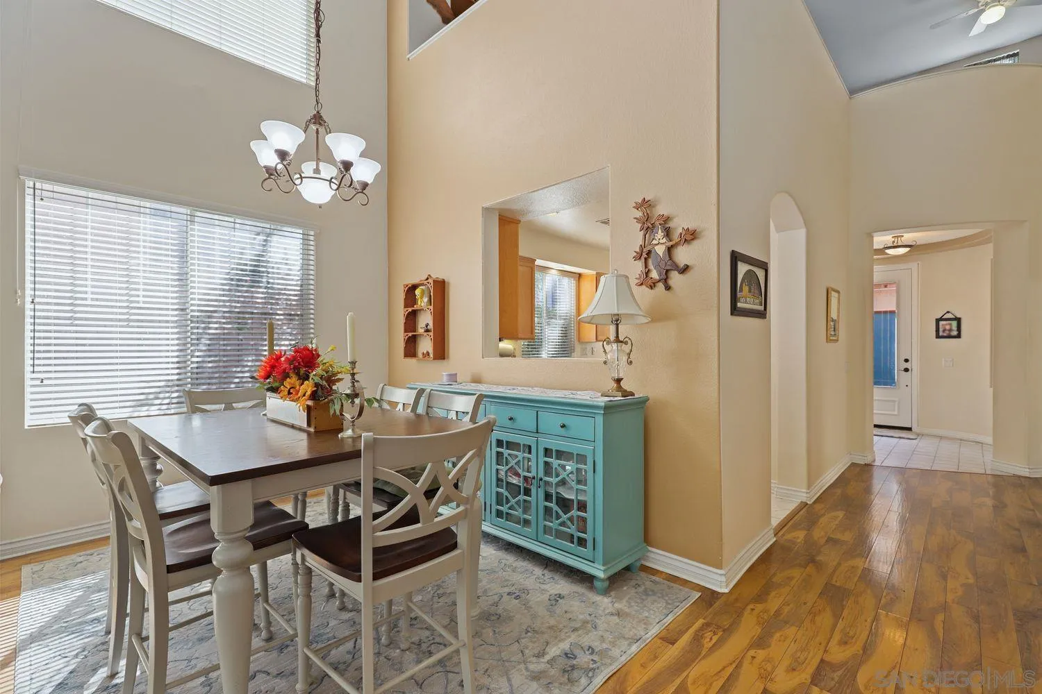 554 Poets Square Fallbrook, CA 92028 - Photo 4 of 28 a view of a dining room with furniture and a chandelier
