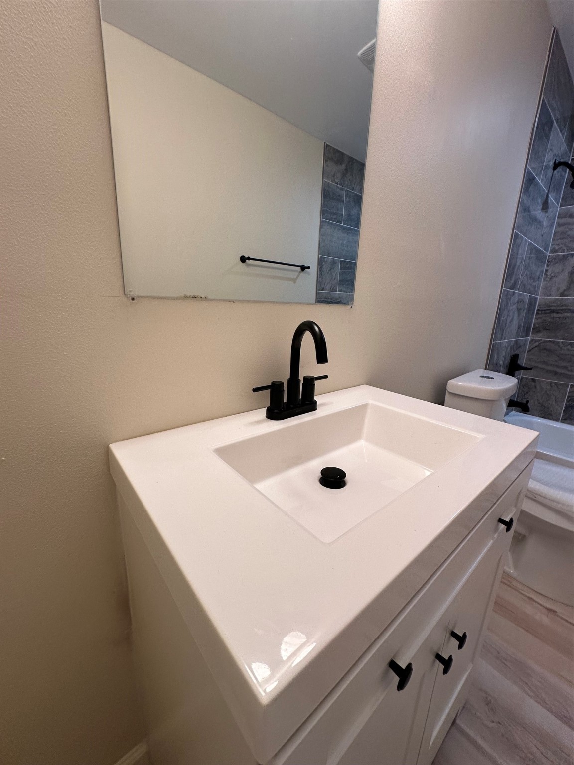 5910 East Houston Road Houston, TX 77028 - Photo 11 of 33 a bathroom with a sink and a mirror