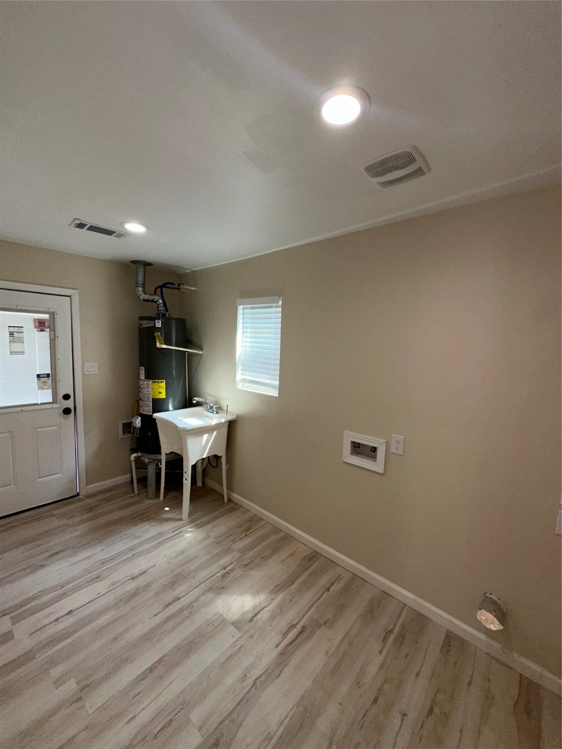 5910 East Houston Road Houston, TX 77028 - Photo 16 of 33 a view of a room with furniture window and wooden floor