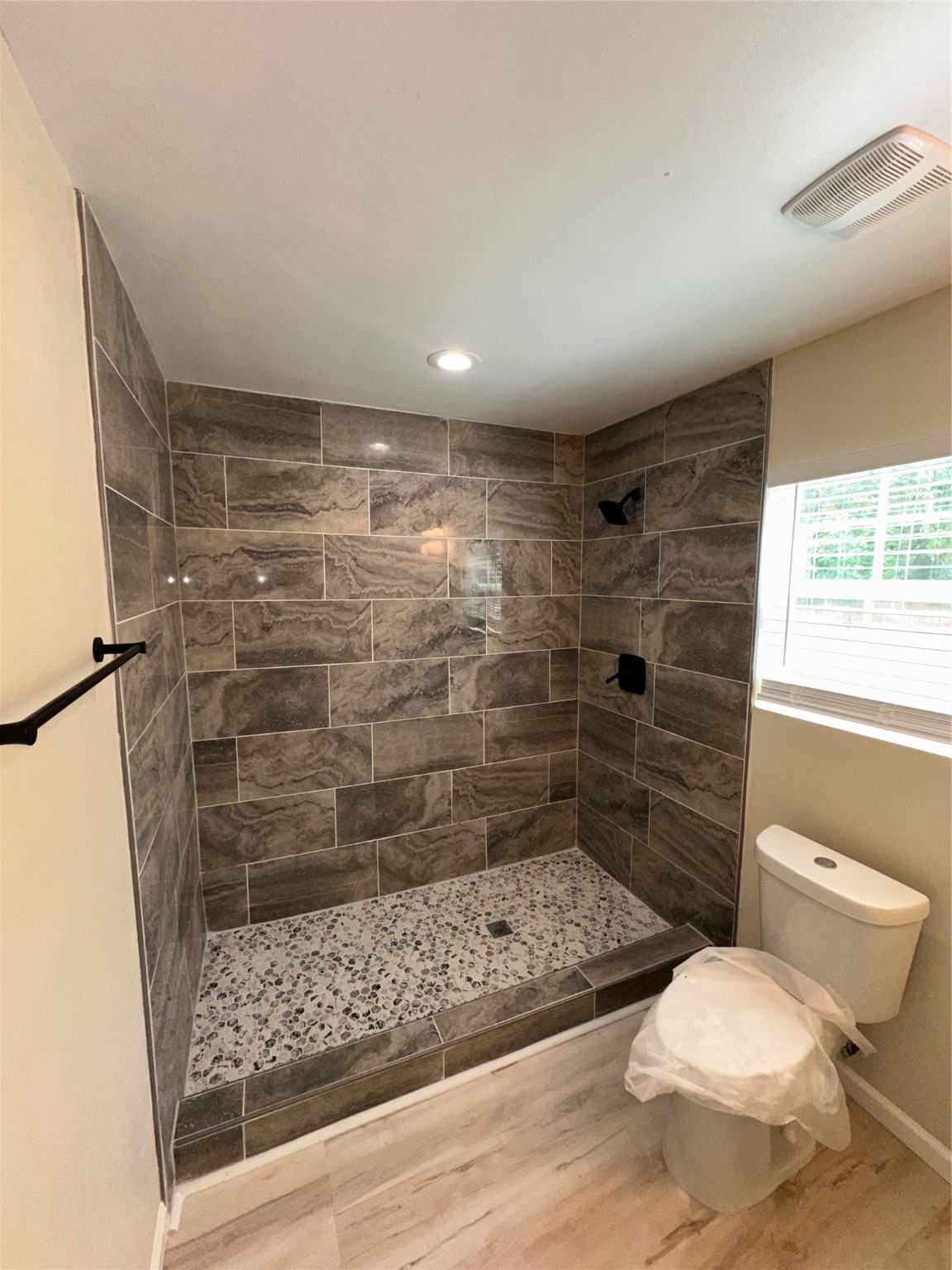 5910 East Houston Road Houston, TX 77028 - Photo 21 of 33 a bathroom with a toilet and a shower