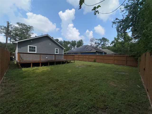 a view of a house with a back yard