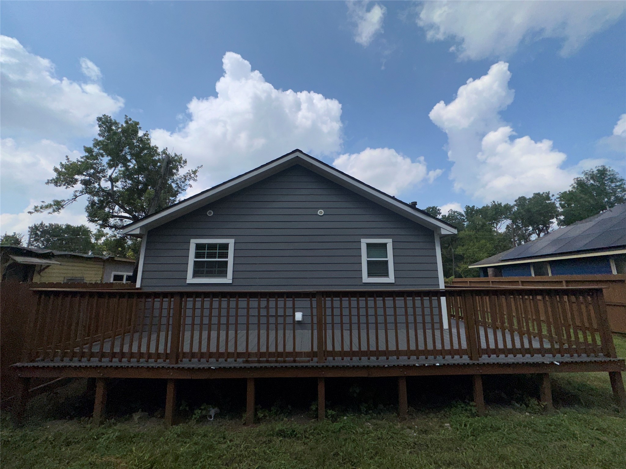 5910 East Houston Road Houston, TX 77028 - Photo 28 of 33 a view of a house with a deck and a yard