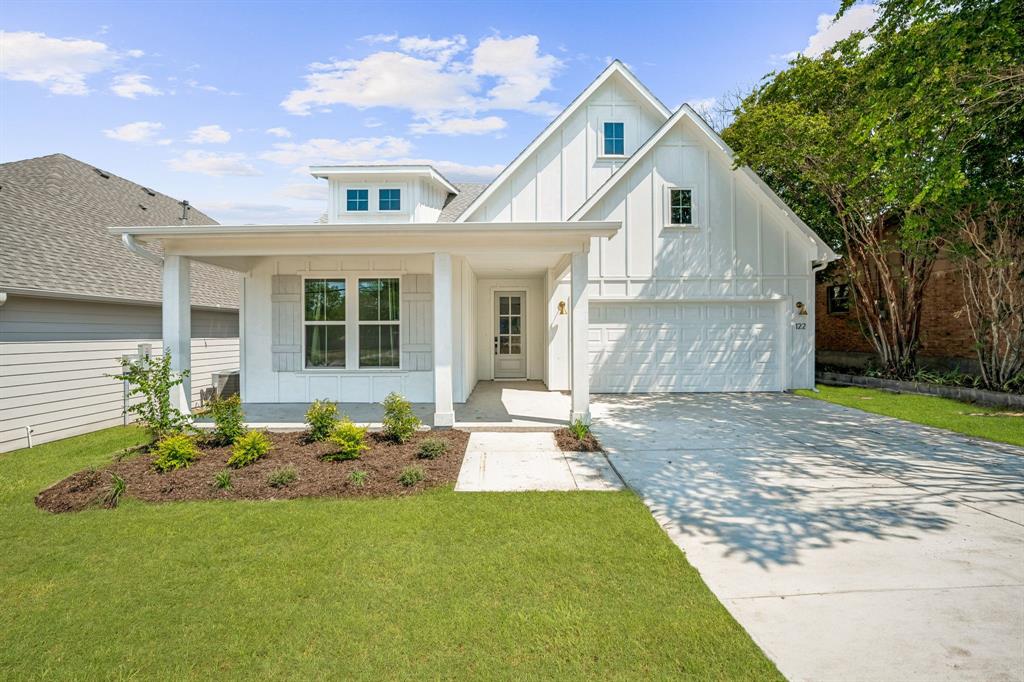 122 John Street Aledo, TX 76008 - Photo 1 of 33 a front view of a house with sitting area and garden