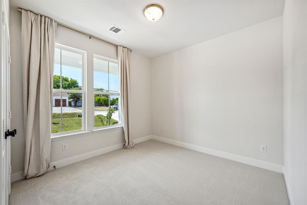 122 John Street Aledo, TX 76008 - Photo 17 of 33 an empty room with windows and view