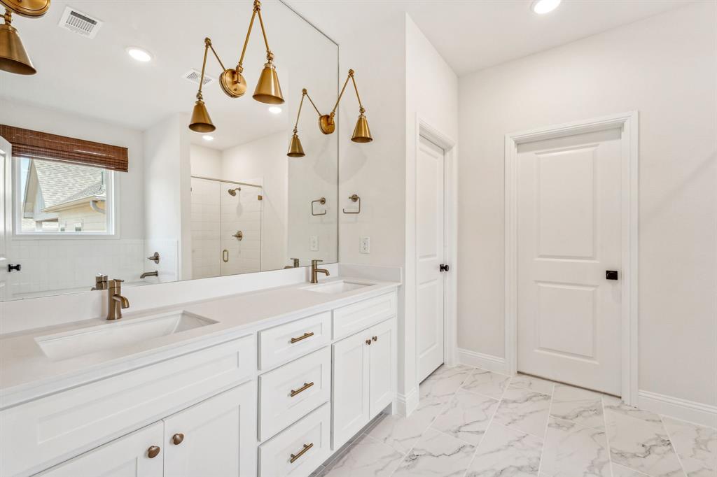122 John Street Aledo, TX 76008 - Photo 4 of 33 a bathroom with a double vanity sink mirror and