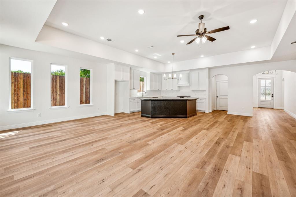 122 John Street Aledo, TX 76008 - Photo 7 of 33 a view of empty room with wooden floor and window