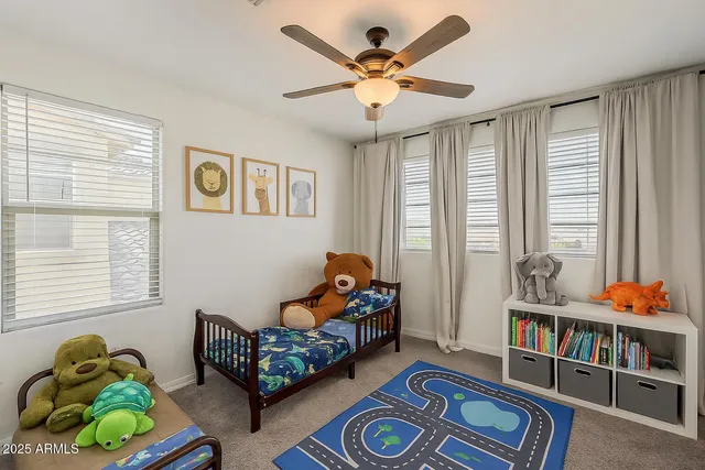 a bedroom with bed and a window