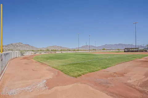 a view of outdoor space with playground and green space