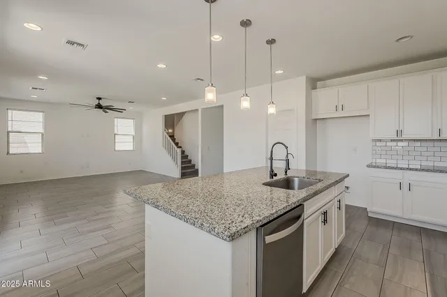 a view of a lake with houses in the back