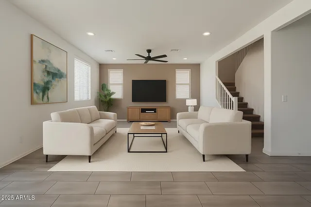 a front view of a house with a yard and a garage