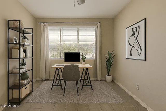 a view of a livingroom with furniture and window