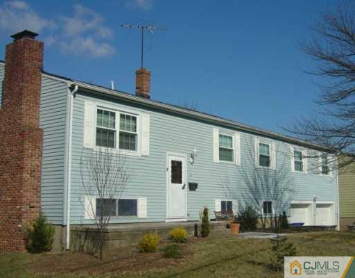 14 Lexington Road Somerset, NJ 08873 - Photo 1 of 8 a front view of a house with a yard
