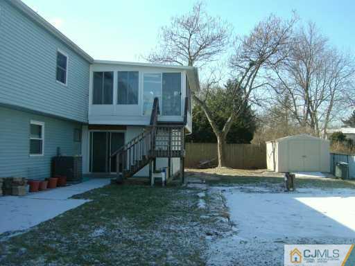 14 Lexington Road Somerset, NJ 08873 - Photo 2 of 8 a view of a house with backyard and a tree