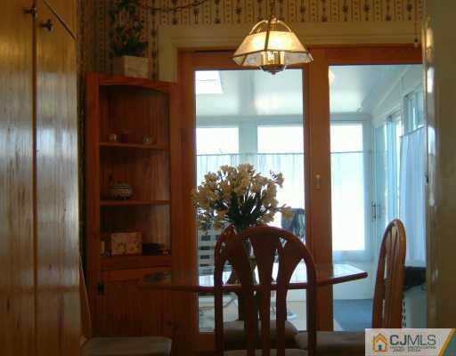 14 Lexington Road Somerset, NJ 08873 - Photo 7 of 8 a view of a dining room with furniture and window