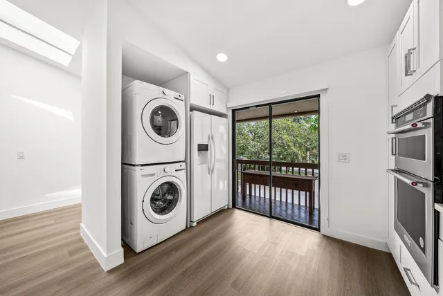 a view of a hallway with washer and dryer