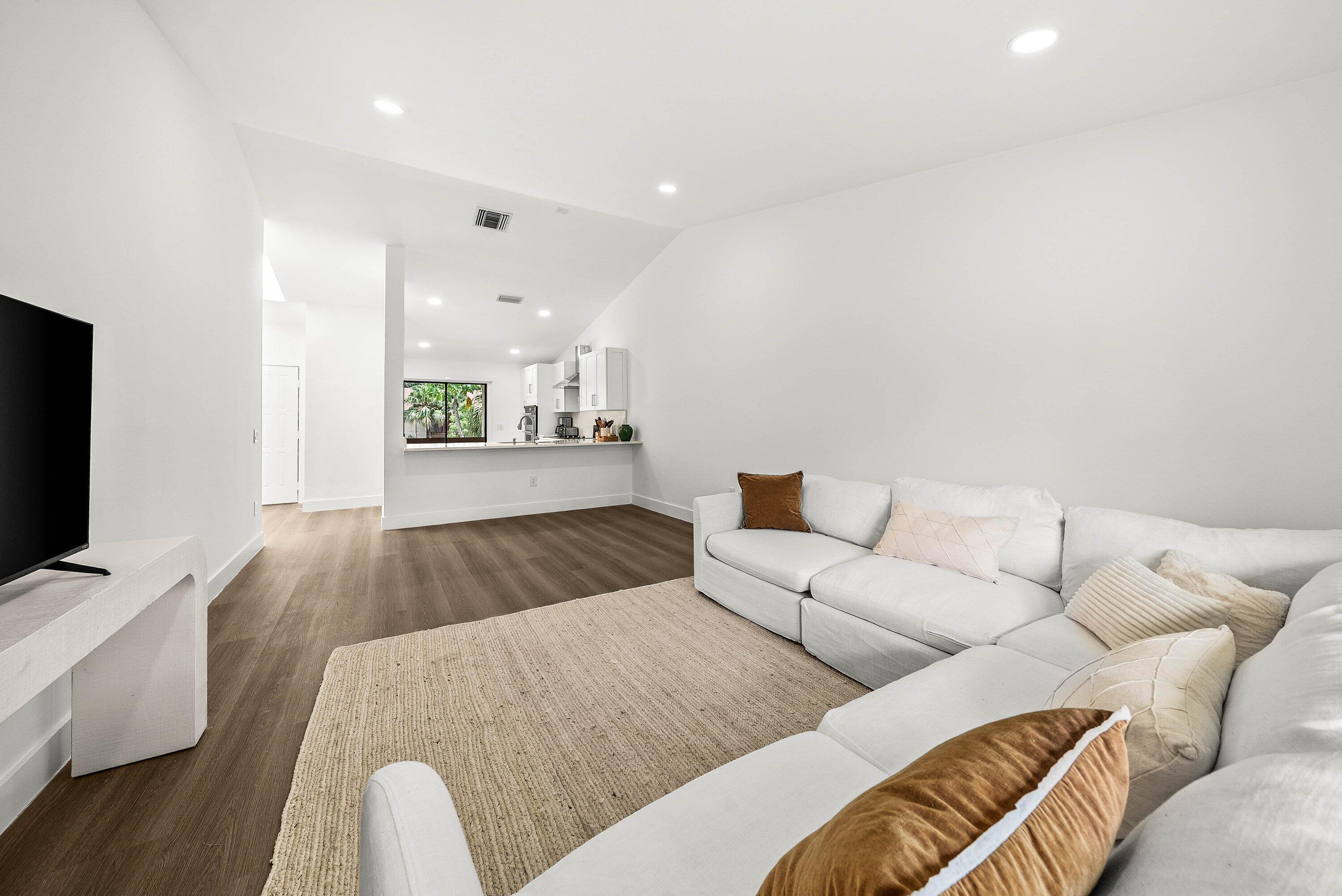 13105 Belhaven Court, Unit 15 Wellington, FL 33414 - Photo 19 of 31 Living Room with TV