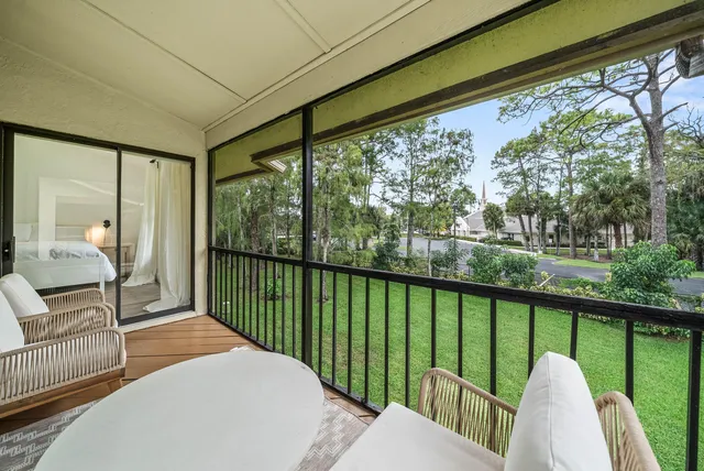 a view of balcony with furniture