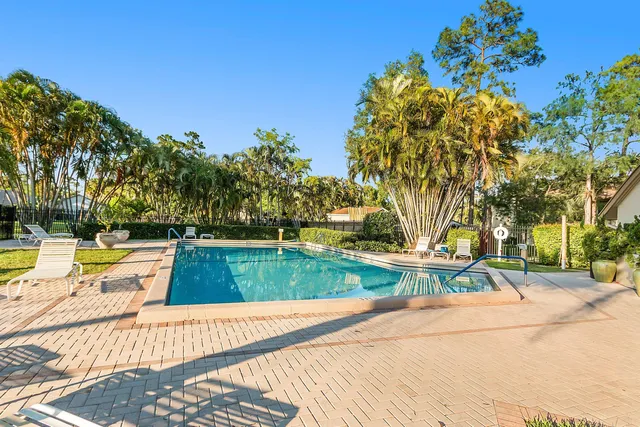a view of a swimming pool with a lounge chair