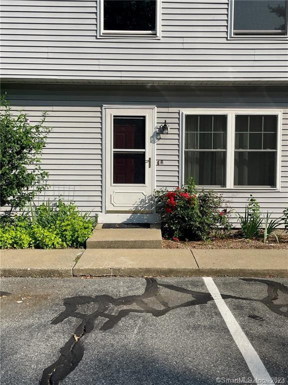 453 Bayonet Street, Unit 8 New London, CT 06320 - Photo 1 of 1 a front view of a house with a yard and a garage