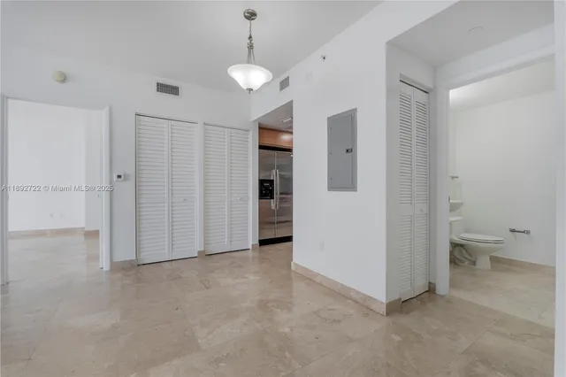 a view of a hallway with washer and dryer