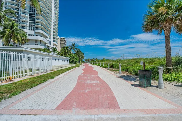 a view of a street with a yard