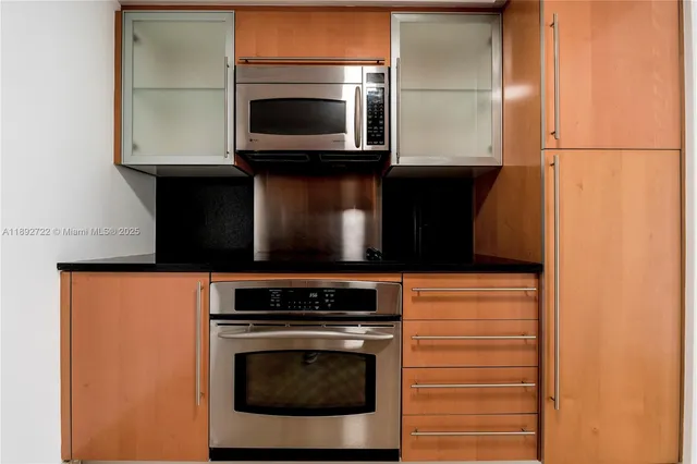 a kitchen with a stove and a microwave