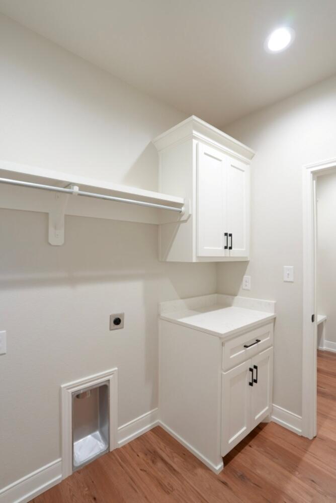 712 East 19th Street Wolfforth, TX 79382 - Photo 15 of 23 a view of a kitchen with wooden floor