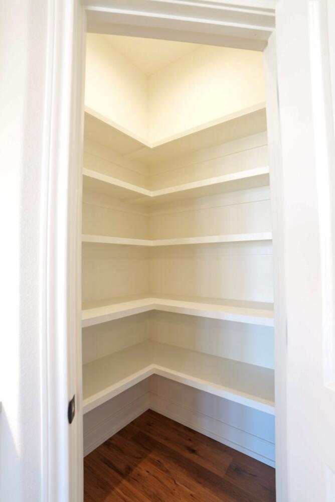 712 East 19th Street Wolfforth, TX 79382 - Photo 21 of 23 a view of walk in closet with empty racks