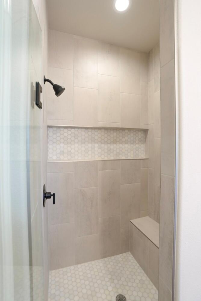 712 East 19th Street Wolfforth, TX 79382 - Photo 9 of 23 a bathroom with a shower